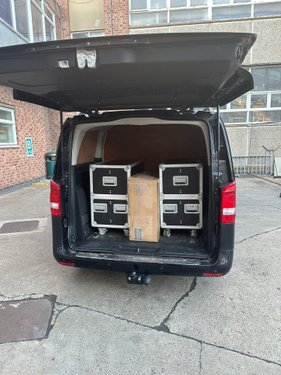 R3-branded van loaded with server flight cases for on-site collection