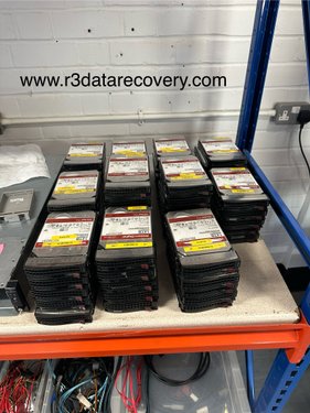 Stacks of labelled enterprise hard drives on R3 lab shelf