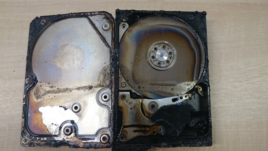 Fire-damaged hard drive platters being examined